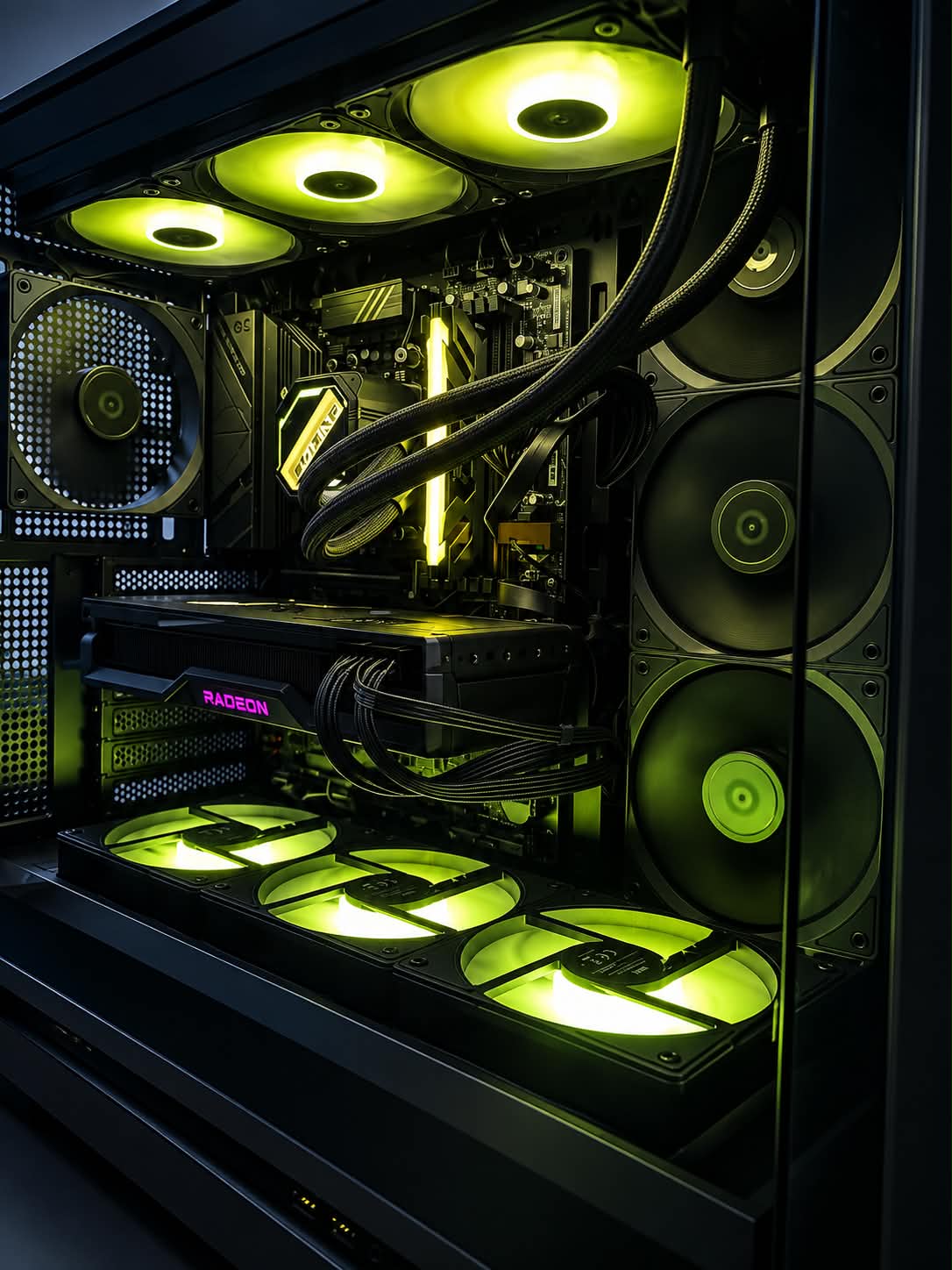 Inside a PC with a Radeon graphics card, AIO liquid cooling and green RGB fan lighting