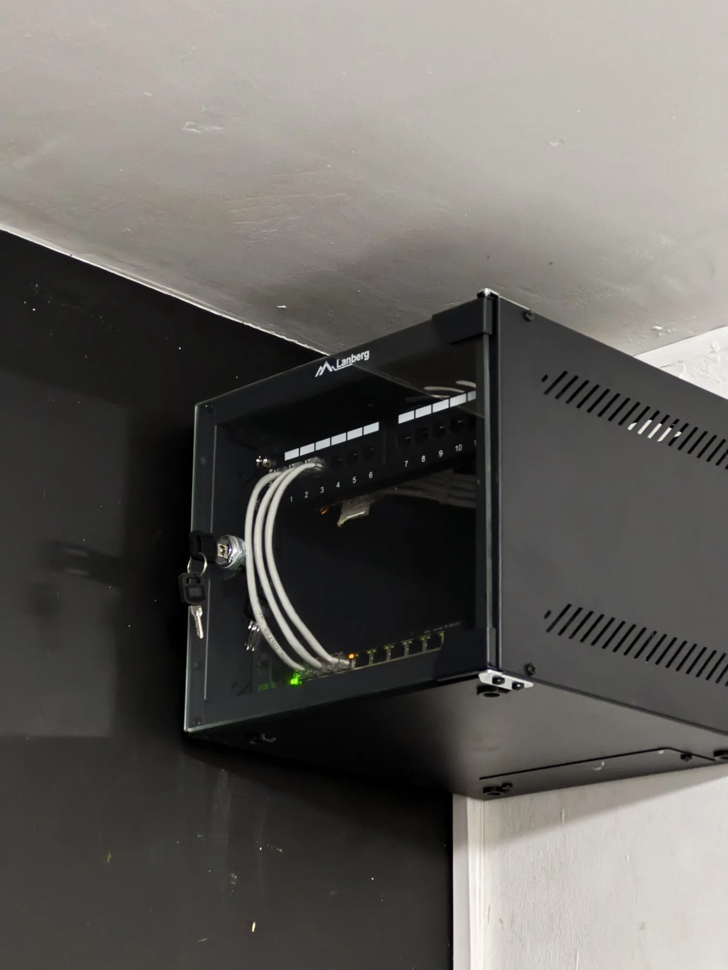 The same cabinet after adding a patch panel and tidying the cabling